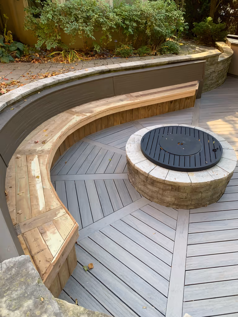 A circular bench with a fire pit.